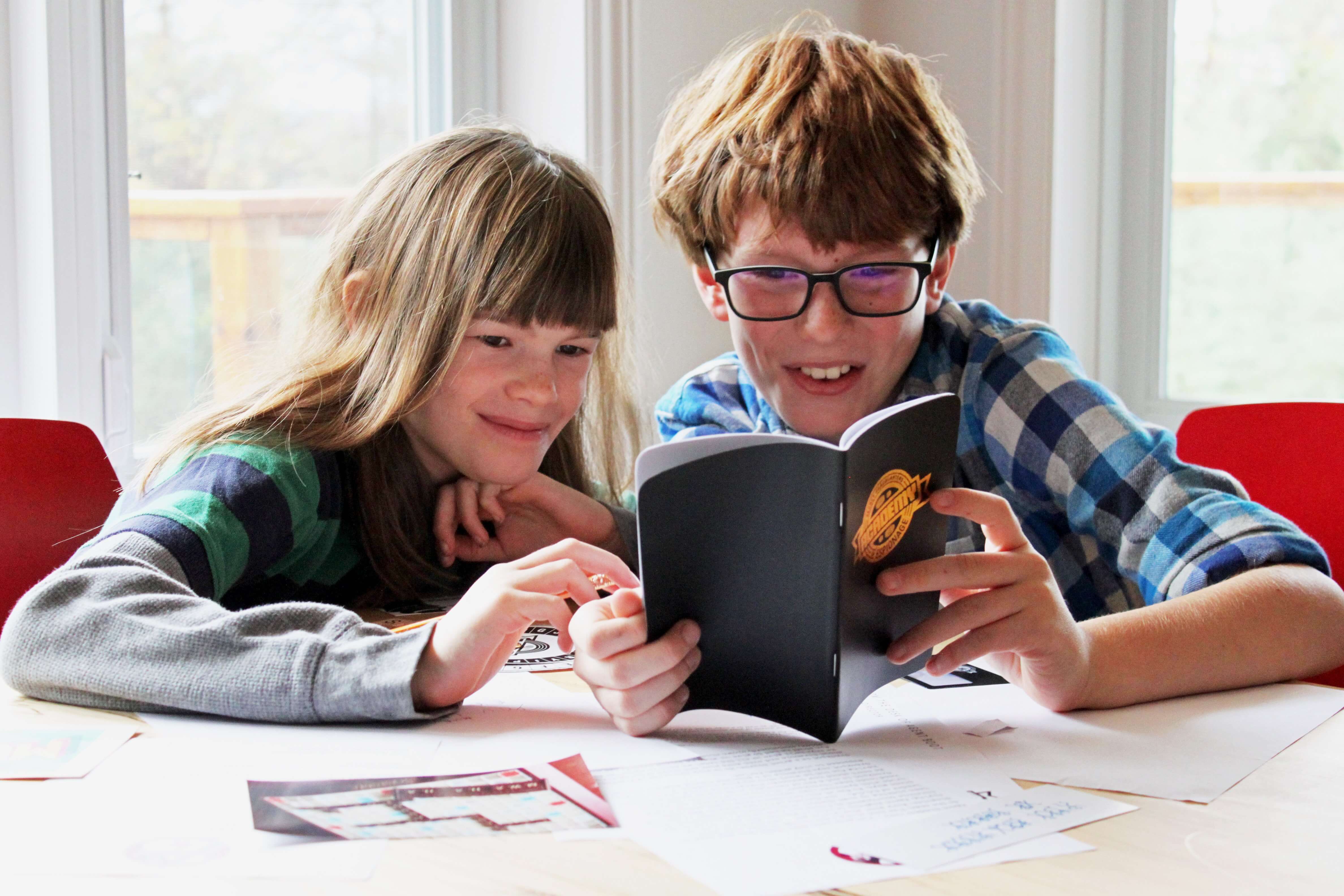 Boy and girl solving a Mail Order Mystery together